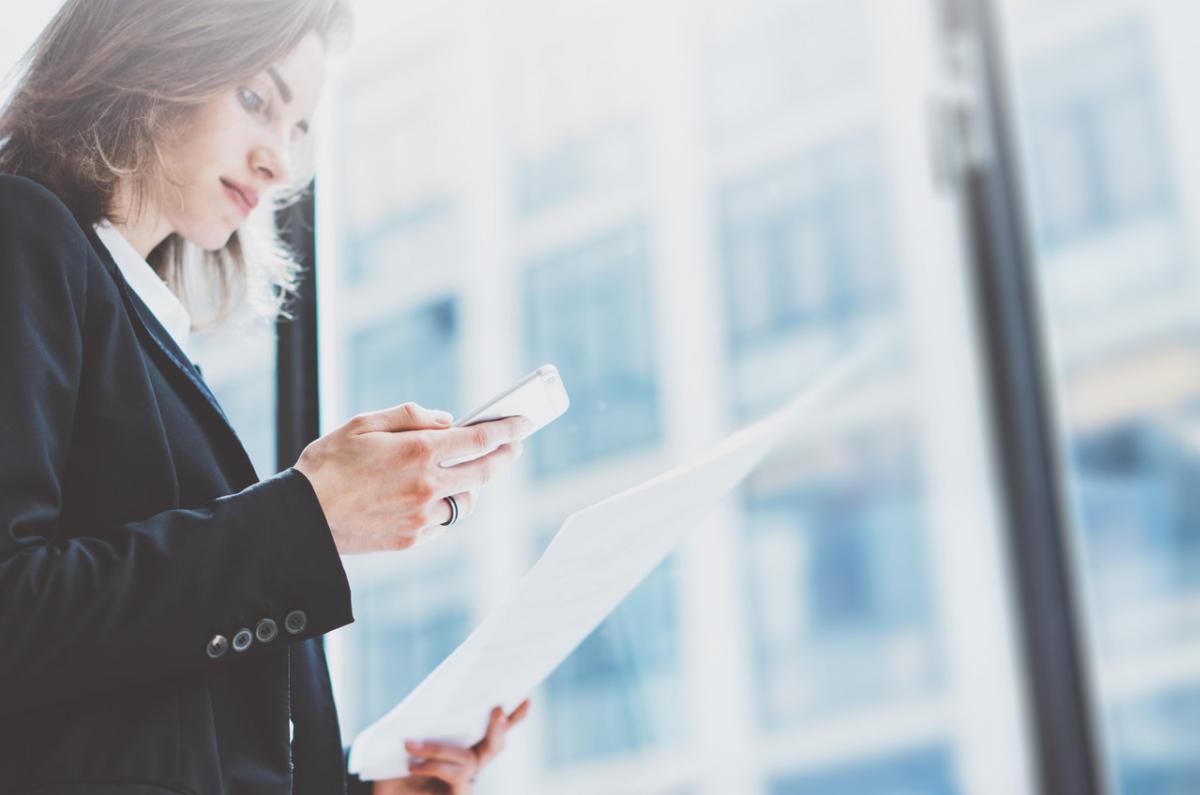 Woman scanning documents into document management system