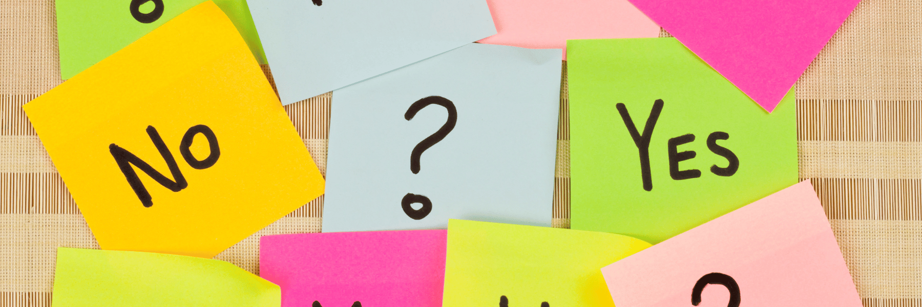 colorful post-in notes with yes, no, and a question mark written on it