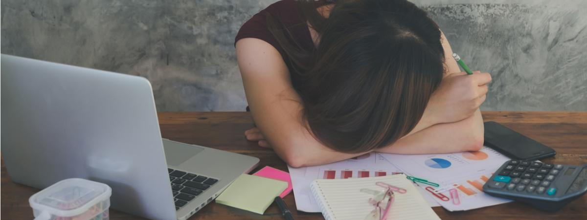 an employee with their head down and in a slump