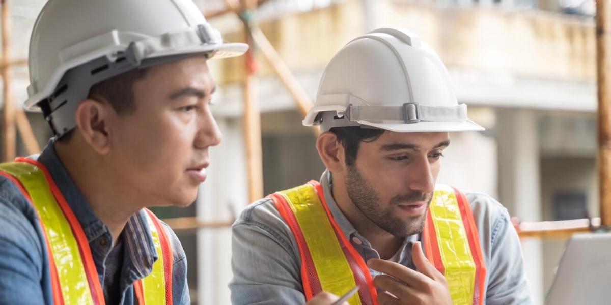 IT professionals monitoring infrastructure systems in a modern office environment