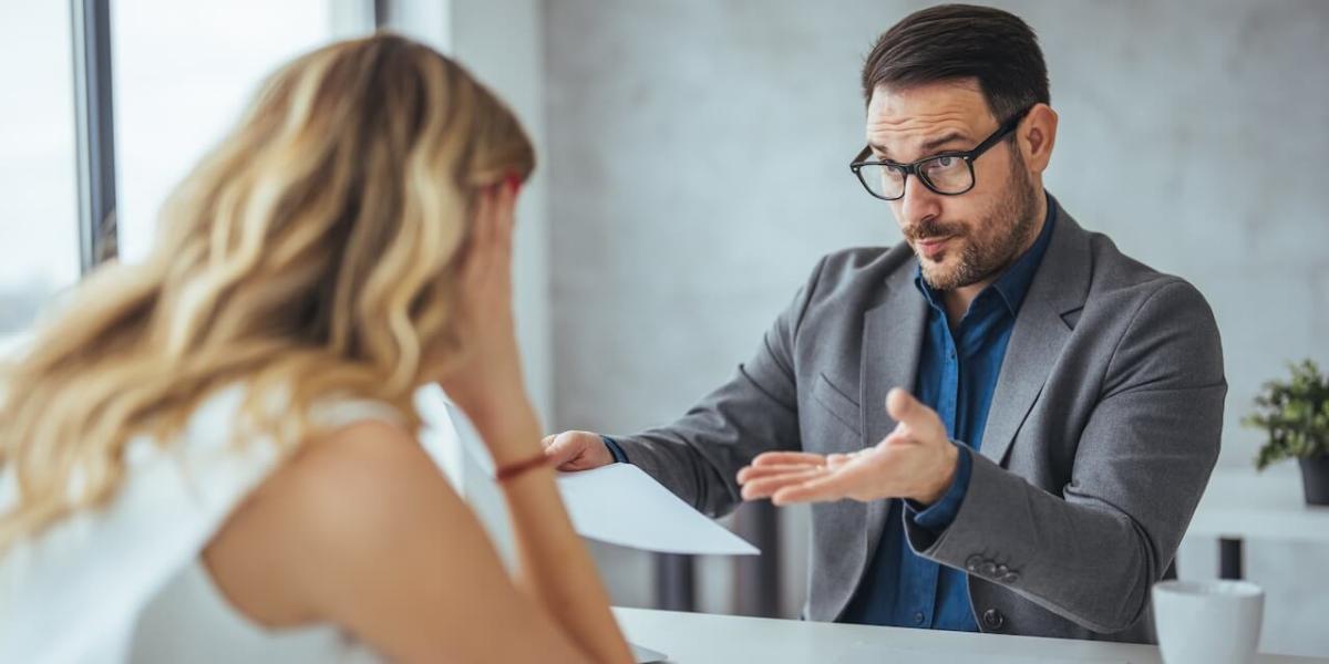Office manager reviewing digital document workflow dashboard on computer