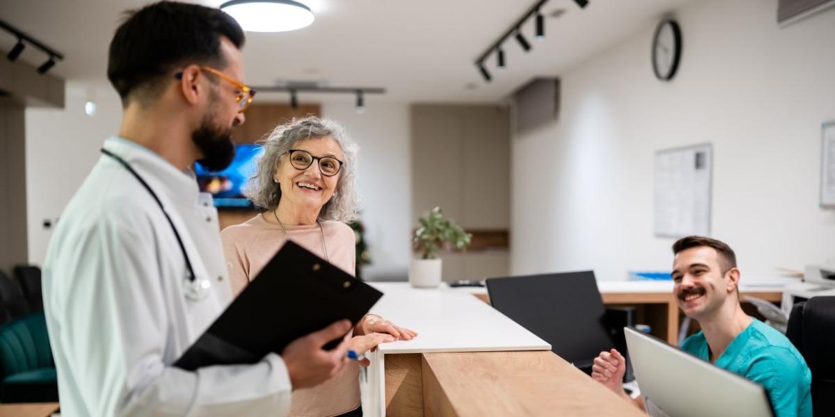  Healthcare administrative staff reviewing patient documentation and workflows in an office
