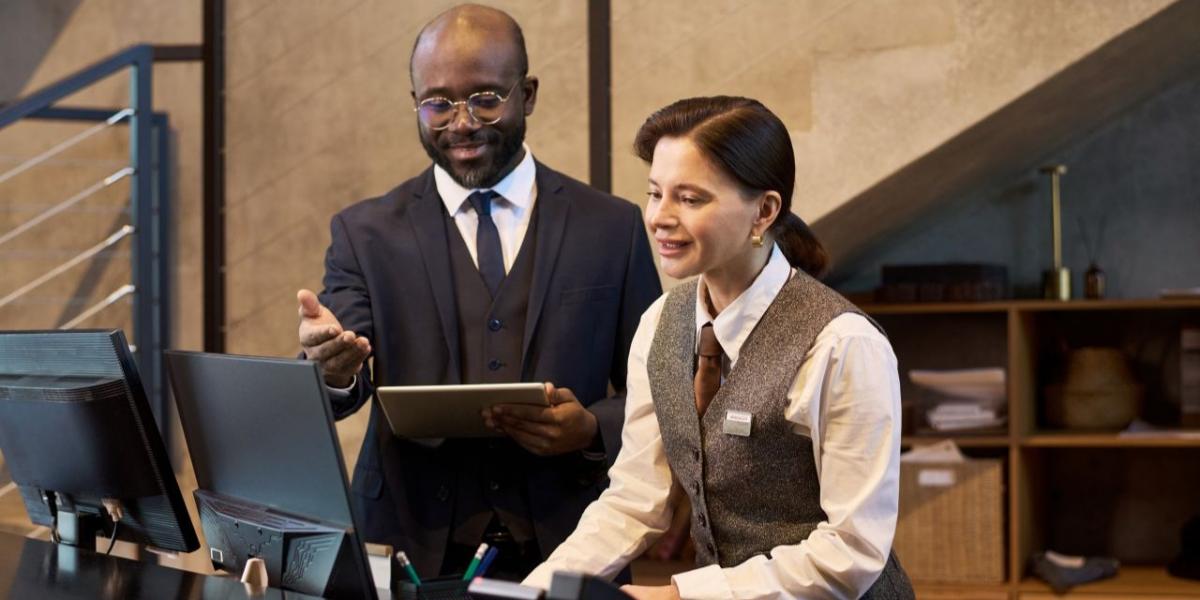 Hotel front desk staff using integrated technology systems