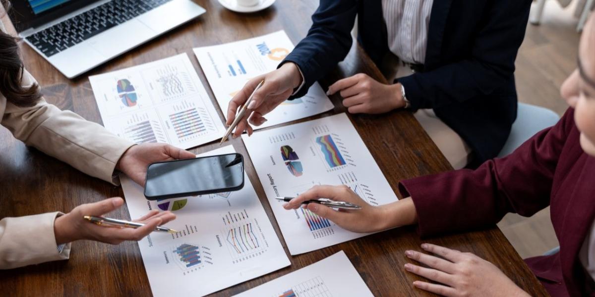 Office manager reviewing print usage analytics dashboard on computer screen