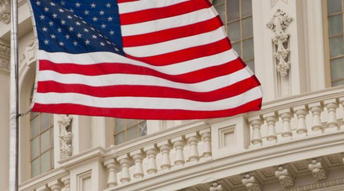 American Flag flying in front of government building